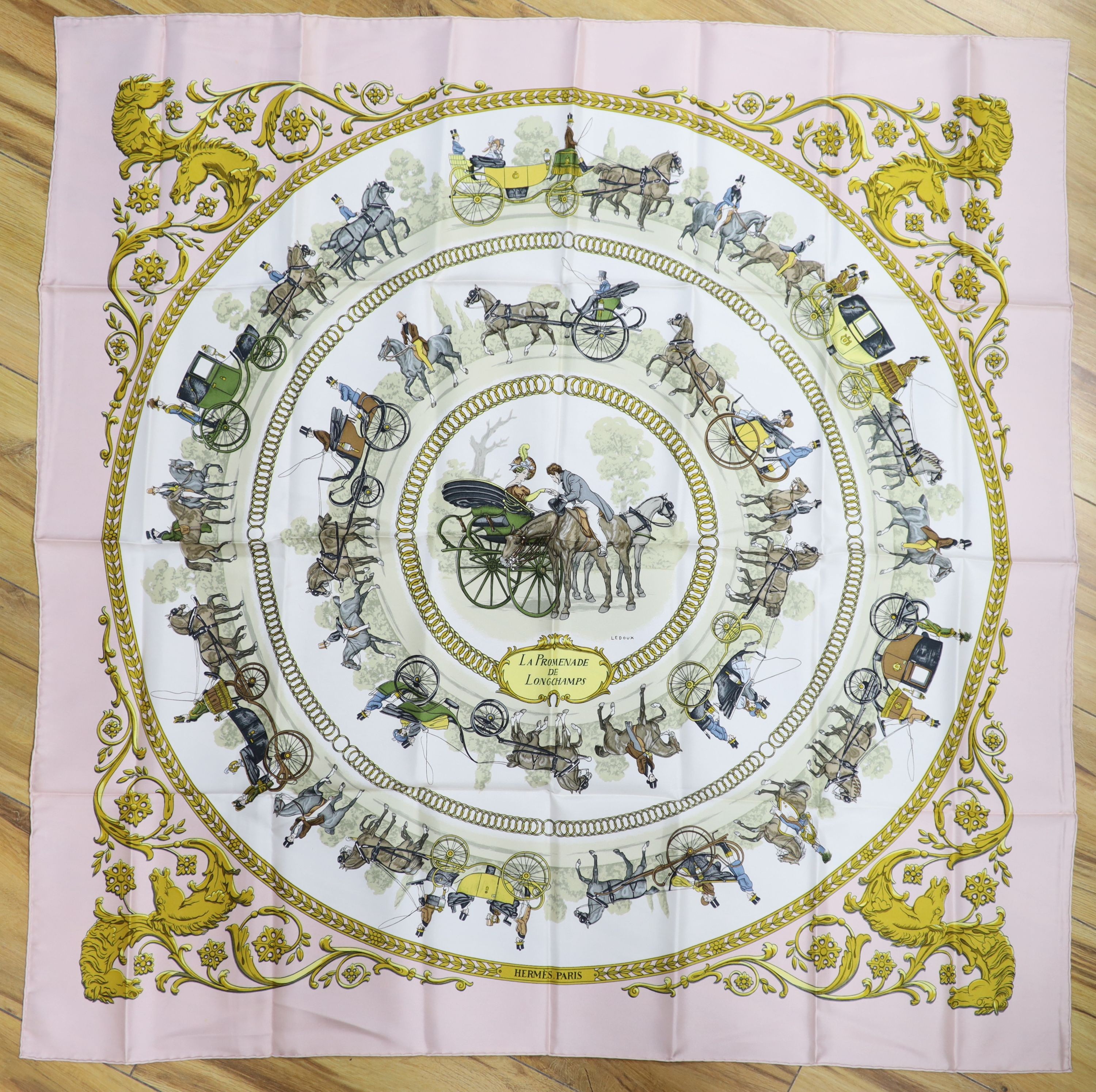 Two Hermes silk scarves - 'La Promenade de Longchamp' designed by Philippe Ledoux, first issued in 1965, with slip case, the other 'The Tarot'